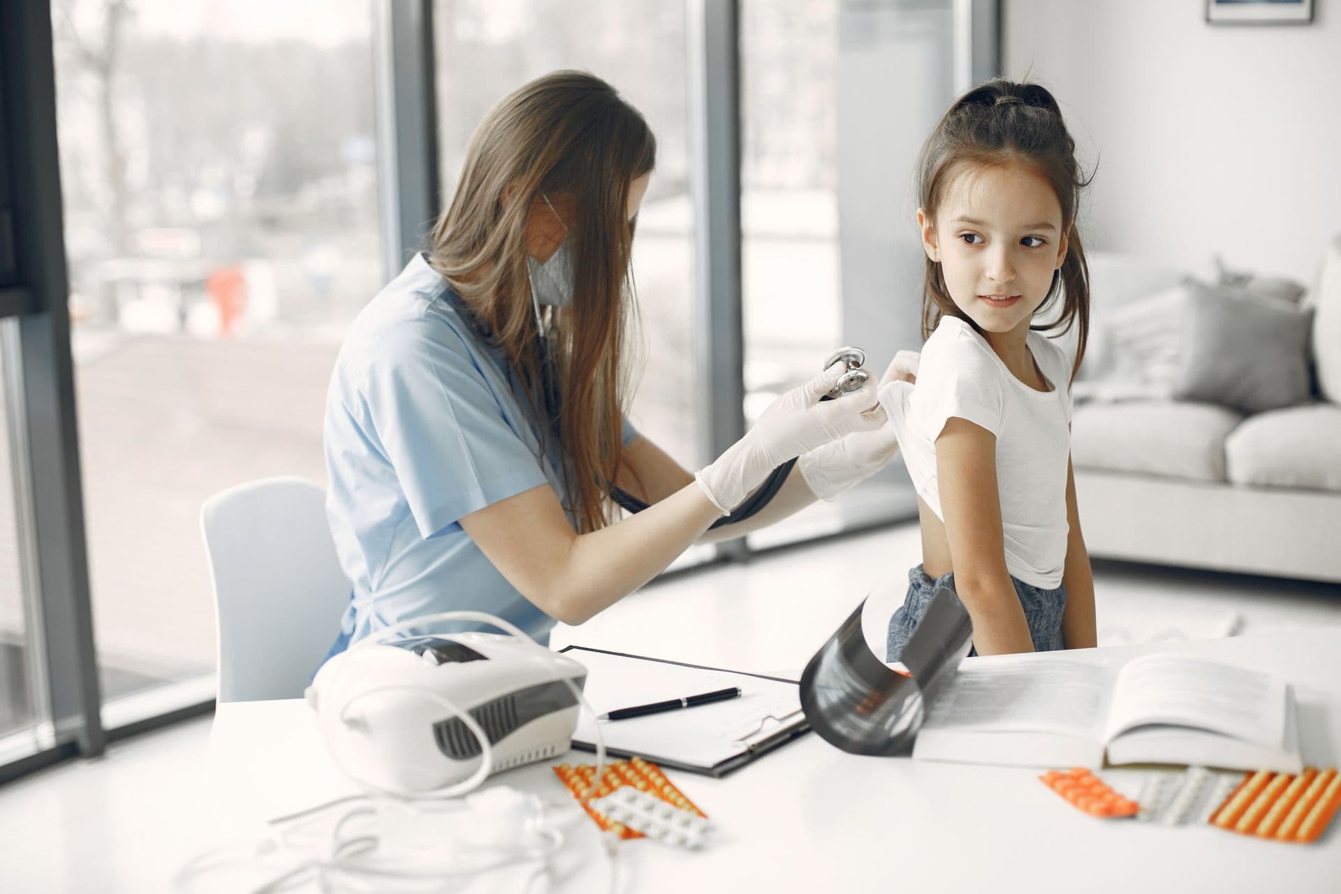 Pediatrician caring for a young patient