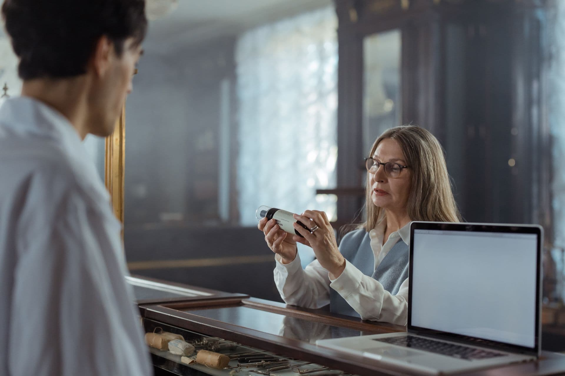 Pharmacist dispensing medication in a pharmacy